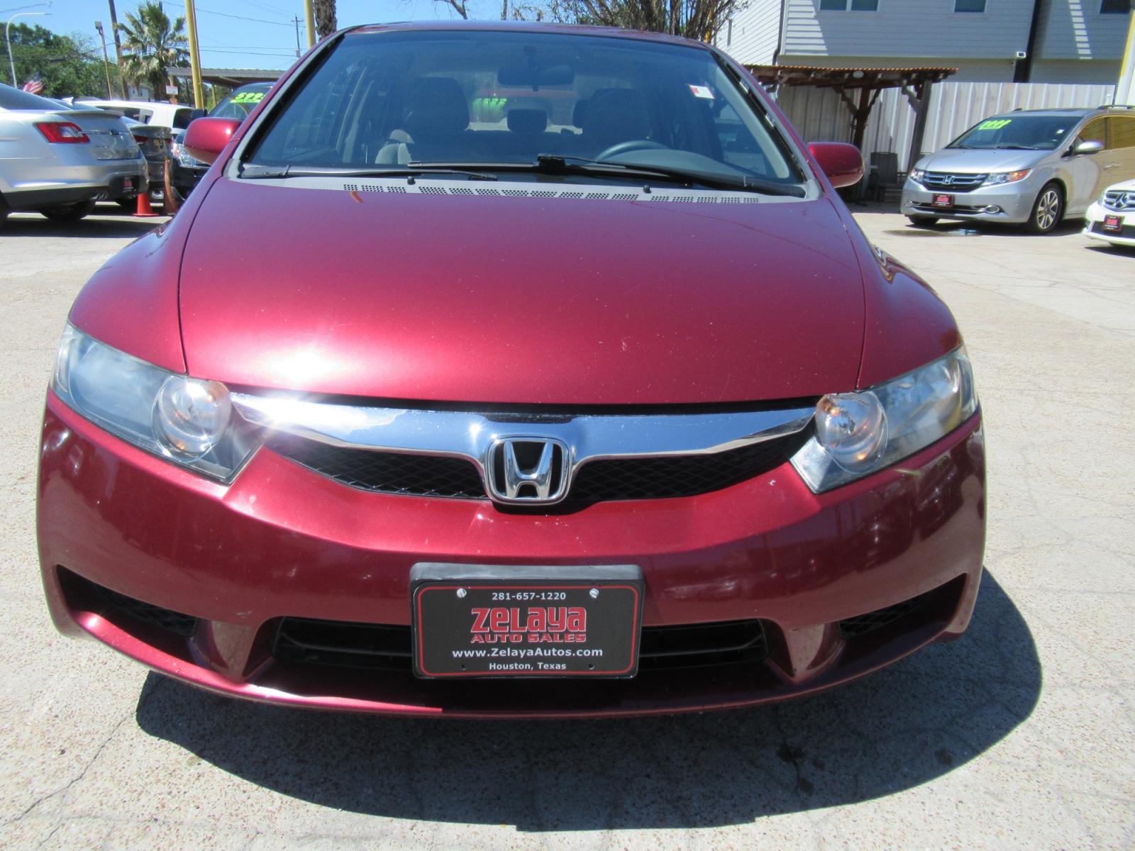 2009 Red /Tan Honda Civic LX Sedan AT (19XFA16529E) with an 1.8L L4 SOHC 16V engine, Automatic Overdrive transmission, located at 1511 North Shepherd Dr., Houston, TX, 77008, (281) 657-1221, 29.798361, -95.412560 - 2009 HONDA CIVIC LX VIN: 19XFA16529E042917 1 9 X F A 1 6 5 2 9 E 0 4 2 9 1 7 SEDAN 4 DR 1.8L I4 F SOHC 16V GASOLINE FRONT WHEEL DRIVE - Photo #19
